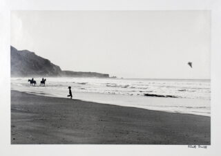 18&emsp;&emsp;Elliott Erwitt. Stinson Beach Boy with Kite. 1975